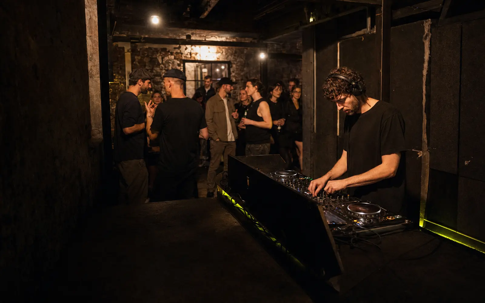 Electronic DJ performing in an intimate Berlin club